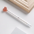White metal ballpoint pen with rose gold polka dots and a heart-shaped crown top - 1.0mm Bullet Tip Black Ink / White Polka Dot