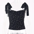 Detail of black floral tie-strap camisole featuring sweet heart print and ruched bust design - S / Black