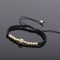 Adjustable black cord bracelet featuring gold beads and a sparkling zircon centerpiece - Gold Style 1