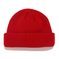 Detailed close-up of a red ribbed knit beanie with fold-over cuff on white background - M / Red