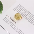 Round resin pendant with yellow dried flower and gold metal loop for DIY jewelry - Yellow