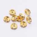 Detail of 9 golden rondelle spacer beads with inlaid clear crystals for DIY jewelry making - 6mm / Gold