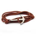 Detail view of brown braided nylon cord wrap bracelet with silver anchor clasp on white background - Brown