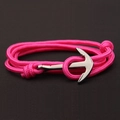 Detail of pink nylon rope bracelet with silver anchor clasp on dark brown background - Rose Red
