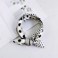 Elegant white square silk scarf with black polka dots tied in a bow on a magazine - Patch Dot Black White