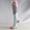 Pink and blue striped athletic compression socks shown on a mannequin leg for support - S/M / Pink with Black Stripes