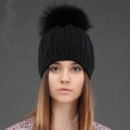 Women's black cable knit winter beanie with a large faux fur pompom and ribbed cuff - Black + Black Pom Pom