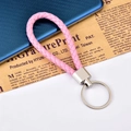 Pink braided leather keychain with polished silver metal ring and U-shaped design - Pink