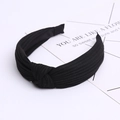 Detailed texture of black ribbed knit fabric on a wide cross-knot headband for women - Black