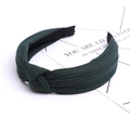 Detail shot of a dark green ribbed knit headband featuring a stylish knotted design - Dark Green