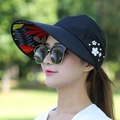 Black sun hat with tropical leaf lining and floral detail for outdoor UV protection - Leaf Pearl Decor / Black