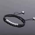 Detailed shot of handmade woven black cord bracelet with polished silver beads and pull closure - Silver Style 2