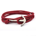 Handmade red nylon rope anchor bracelet with polished silver nautical clasp on white background - Burgundy