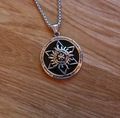 Vintage silver sun engraved pendant necklace with runes on a rustic wood surface - Solar Hexagram + Steel Chain