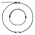 Black leather cord jewelry set featuring single white shell pearls for women - Shell Pearl Necklace And Bracelet Set
