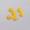 Detailed view of 10mm yellow resin cabochons with textured surface and smooth flat back - Yellow (20)