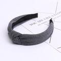 Detail of dark grey knitted fabric texture and twisted knot on wide cotton headband - Dark Gray