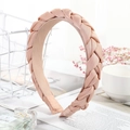 Chic pink braided fabric headband with a stylish twisted design for hair styling - Pink