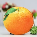 Plush orange fruit coin purse with realistic citrus texture and green leaf detail - Orange