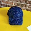 Close-up of sparkling blue rhinestones on a black baseball cap with vibrant reflections - Adjustable / Blue