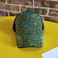Detailed macro view of vibrant iridescent rhinestones on a stylish black baseball cap - Adjustable / Green