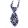 Polyester woven pet tie featuring white skull patterns on a dark blue background - Deep Blue with White Skulls