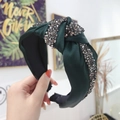 Dark green knotted headband featuring sparkling grey rhinestones and smooth satin fabric - Dark Green
