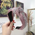 Pink satin knotted headband decorated with sparkling silver rhinestones for elegant styling - Pink