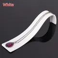 Silver necklace with a purple waterdrop pendant on a white display stand - White