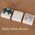Three elegant white jewelry gift boxes with satin bows in green, cream, and silver grey - Cream White Bow Decorated Box