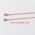 Macro detail of 2mm rose gold stainless steel box chain with lobster clasp on white background - 2mm Rose Gold Color