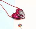 Detail of heart-shaped kids crossbody bag featuring flip sequins and a red cord strap - Rose Red + Silver