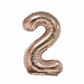 Detailed view of large rose gold 40-inch foil balloon in the shape of number 2 - Number 2 / Rose Gold
