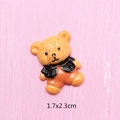 Detail shot of a 1.7x2.3cm resin cartoon bear charm with glossy finish for DIY crafts - Bear in Black Jacket
