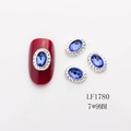 7x9mm oval nail art gem with silver braided edge and blue crystal on red manicure - Silver Base Sapphire Blue Rhinestone Small (1780)