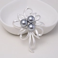 Elegant matte silver floral brooch with three grey pearls displayed on a white plate - 0471-Silver Flower Three-Pearl