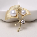 Elegant gold ginkgo leaf brooch featuring two white pearls and a sparkling rhinestone - 0479-Gold Ginkgo Leaf Pearl