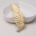 Elegant matte golden feather brooch featuring a delicate white pearl accent - 0482-Gold Feather Pearl