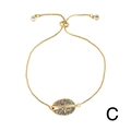 Detail of adjustable gold shell bracelet featuring colorful cubic zirconia pave setting - Style C-Gold Shell Bolo Chain