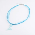 Detail of blue ribbon cord necklace with a transparent glittery mermaid tail pendant - Small Blue Tail (10)
