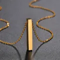 Macro view of polished gold bar pendant with delicate chain on a textured surface - O-Chain 50CM / Gold