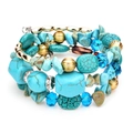 Pulsera elástica multicapa con piedras turquesas, cuentas de cristal y toques dorados - Azul lago