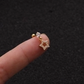 Macro shot of gold starfish helix stud with zircon inlay held on fingertips for size - Gold Star Style (Gold 3#)