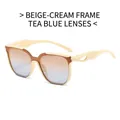 Cremefarbene quadratische Sonnenbrille mit teeblauen Verlaufsgläsern und hohlen Bügeln - Beigefarbener Rahmen Braun Blaue Linsen