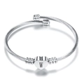 Detailed macro view of silver steel twisted rope bracelet with letter W heart charm - Letter W / Steel