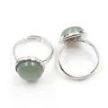 Top view of two adjustable silver rings featuring round green stone beads on white background - Adjustable Open / Green Aventurine