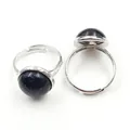 Macro detail of adjustable silver ring with blue goldstone cabochon featuring glitters - Adjustable Open / Blue Sandstone