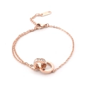 Elegant rose gold titanium steel bracelet featuring interlocking roman numeral crystal rings - Rose Gold with White Zirconia