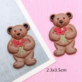 Macro detail of brown resin teddy bear charms holding flowers for DIY crafts, size 2.3x3.5cm - Coffee Bear with Rose