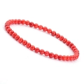 Close-up of 4mm vibrant red agate beaded bracelet with smooth polished natural stones - Red Jasper